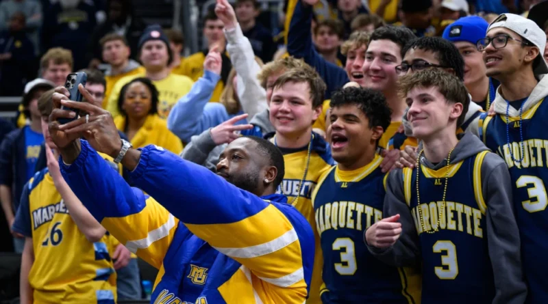 A fan taking a selfie with a WNBA player; The Galaxy S26 Ultra in Cobalt Violet; A diagram of the new 200MP f/1.4 camera lens